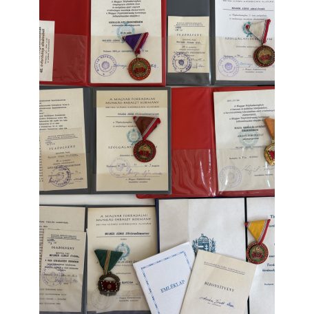 Hungarian Large 9 medal & badge lot with award folders to a senior Peoples Army NCO