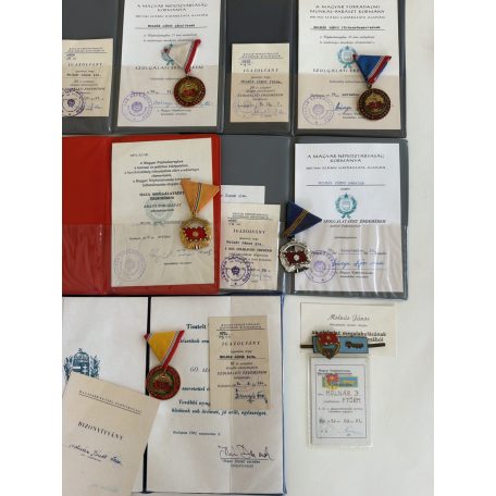 Hungarian Large 9 medal & badge lot with award folders to a senior Peoples Army NCO